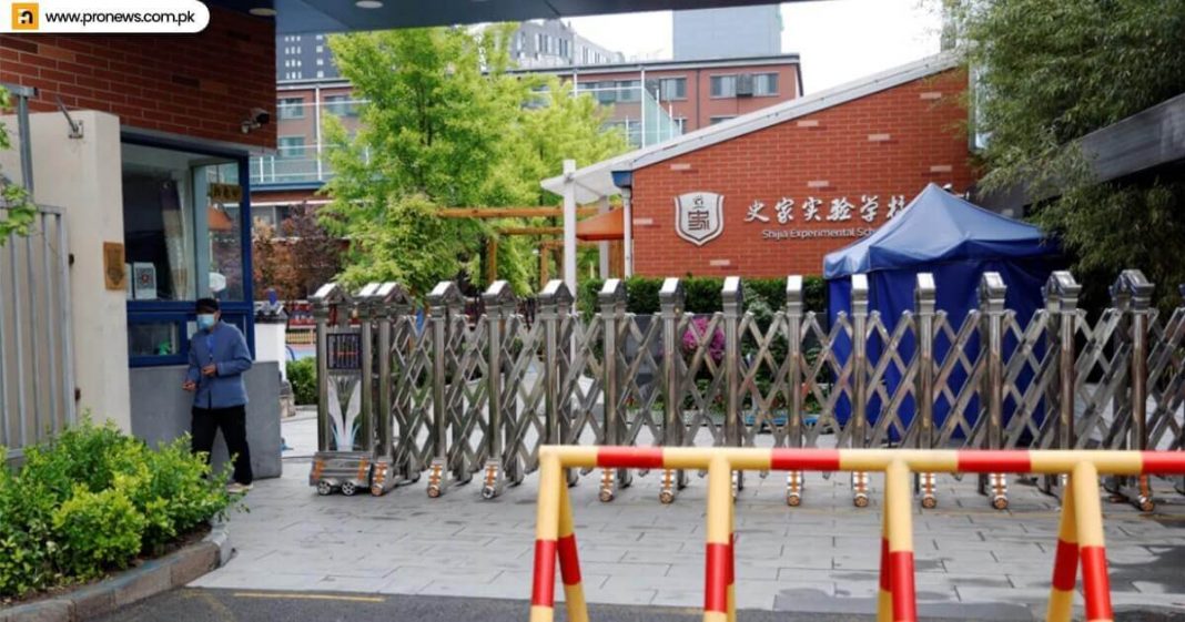 A few Beijing regions shut schools as Covid cases increase in China.