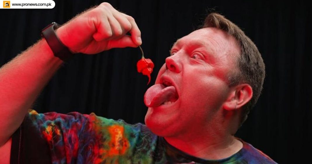 Man eats the hottest chilies in 33 seconds, creating a world record.